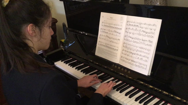 Carmen practicing new grade 6 piece